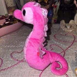 Ty Beanie Baby, specifically "Majestic" the pink seahorse